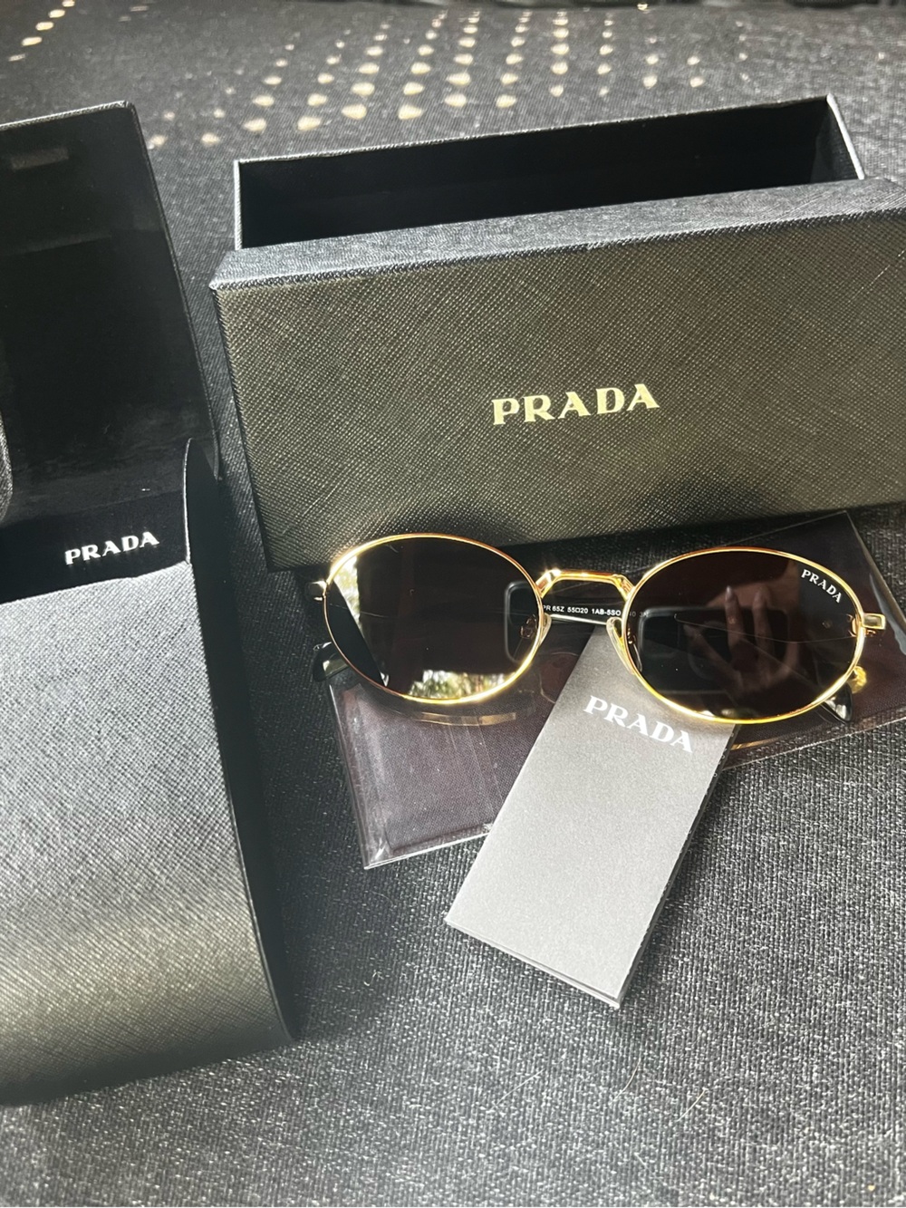 Prada Gold Frame Black Lens Round Sunglasses